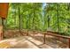 This wooden deck has metal cable railing and overlooks the backyard and separate structure at 2269 Sparrow Ridge Ne Dr, Marietta, GA 30066