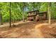 Cabin-style home featuring a deck, hammock and fire pit, nestled in a serene forest at 2269 Sparrow Ridge Ne Dr, Marietta, GA 30066