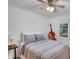 Bedroom with a patterned bedspread, ceiling fan, and a window with view of the woods at 2269 Sparrow Ridge Ne Dr, Marietta, GA 30066