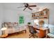 Bright bedroom with light wood floors, stylish decor, and a window with a view of trees at 2269 Sparrow Ridge Ne Dr, Marietta, GA 30066