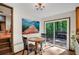Bright dining area with wood floors, sliding glass doors to the deck, and an adjacent living room at 2269 Sparrow Ridge Ne Dr, Marietta, GA 30066