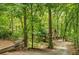 Secluded home nestled among lush trees and foliage, with a long, winding driveway leading to the property at 2269 Sparrow Ridge Ne Dr, Marietta, GA 30066