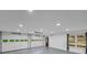 The brightly lit garage has a gray epoxy floor and multiple windows with an automatic garage door at 2269 Sparrow Ridge Ne Dr, Marietta, GA 30066