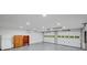 The spacious garage has a gray epoxy floor, lots of storage, and is brightly lit at 2269 Sparrow Ridge Ne Dr, Marietta, GA 30066