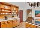 Charming kitchen featuring open shelving, wood cabinets, and easy access to other rooms at 2269 Sparrow Ridge Ne Dr, Marietta, GA 30066