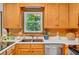 Inviting kitchen with stainless steel sink, natural light, and wood cabinets offering ample storage at 2269 Sparrow Ridge Ne Dr, Marietta, GA 30066