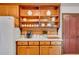 Well-organized kitchen with open shelving, wood cabinets, and modern appliances at 2269 Sparrow Ridge Ne Dr, Marietta, GA 30066