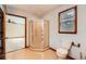 Bathroom with enclosed shower stall, toilet, and window with wood trim at 2538 Morgan Lake Ne Dr, Marietta, GA 30066