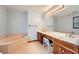 Bathroom featuring double vanity, a tub, and a large mirror with Hollywood lighting at 2538 Morgan Lake Ne Dr, Marietta, GA 30066