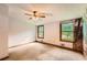 Bedroom with natural light, ceiling fan, carpet flooring, and neutral walls at 2538 Morgan Lake Ne Dr, Marietta, GA 30066