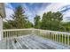 Deck showcasing some wear but offering picturesque views of the surrounding greenery and sky at 2538 Morgan Lake Ne Dr, Marietta, GA 30066
