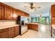Kitchen with wood cabinets and stainless steel fridge, leads to dining area at 2538 Morgan Lake Ne Dr, Marietta, GA 30066