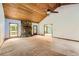 Spacious living room features a stone fireplace and wood planked ceiling at 2538 Morgan Lake Ne Dr, Marietta, GA 30066