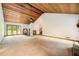 Large living room with wood ceiling, staircase, and big windows at 2538 Morgan Lake Ne Dr, Marietta, GA 30066
