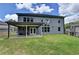 Two-story home with a covered patio and spacious backyard, perfect for outdoor living at 4056 Friendship Creek Dr, Buford, GA 30519