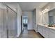 Bright bathroom featuring double vanity, a glass enclosed shower, and neutral tones at 4056 Friendship Creek Dr, Buford, GA 30519