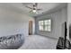 Neutral bedroom with a fan, closet, large window and carpet at 4056 Friendship Creek Dr, Buford, GA 30519