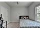 Bright bedroom featuring a window and neutral walls, creating a clean and cozy space at 4056 Friendship Creek Dr, Buford, GA 30519
