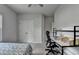 Bright bedroom featuring a window and double-door closet, creating a clean and cozy space at 4056 Friendship Creek Dr, Buford, GA 30519