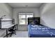 Bedroom with carpet flooring, ceiling fan, and a desk in the corner at 4056 Friendship Creek Dr, Buford, GA 30519