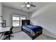 Bedroom with carpet flooring, ceiling fan, and a desk in the corner at 4056 Friendship Creek Dr, Buford, GA 30519