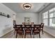 Bright dining room featuring wood-look flooring, a table with seating for eight, and neutral paint at 4056 Friendship Creek Dr, Buford, GA 30519