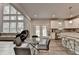 Bright kitchen featuring an island with barstool seating, stainless appliances, and access to backyard at 4056 Friendship Creek Dr, Buford, GA 30519