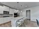 Modern kitchen with a center island, stainless steel appliances, and ample cabinet space at 4056 Friendship Creek Dr, Buford, GA 30519