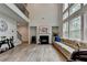 Open living space with high ceilings, fireplace, and large windows for natural light at 4056 Friendship Creek Dr, Buford, GA 30519