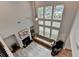 Bright living room with high ceilings, large windows, fireplace, and modern decor at 4056 Friendship Creek Dr, Buford, GA 30519