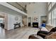 Spacious living room with a fireplace, high ceilings, and plenty of natural light at 4056 Friendship Creek Dr, Buford, GA 30519