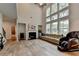 Large living room features a fireplace, high ceilings, and ample natural light at 4056 Friendship Creek Dr, Buford, GA 30519