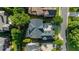 Aerial view of the neighborhood, with the home's roof and driveway visible among lush trees at 745 Glengate Pl, Atlanta, GA 30328