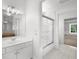 Bright white bathroom features a single sink vanity, and tiled floors at 745 Glengate Pl, Atlanta, GA 30328