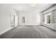 A huge bonus room bathed in white with plush gray carpet and bright windows at 745 Glengate Pl, Atlanta, GA 30328