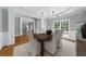 Formal dining room with hardwood floors, decorative chandelier, and abundant natural light at 745 Glengate Pl, Atlanta, GA 30328