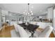 Open concept dining area features hardwood floors, modern light fixture, and plenty of natural light at 745 Glengate Pl, Atlanta, GA 30328