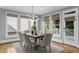 The bright dining room includes a modern light fixture, natural lighting, and hardwood flooring at 745 Glengate Pl, Atlanta, GA 30328