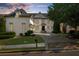 Elegant exterior of a two-story home with a well-manicured lawn and traditional architectural details at 745 Glengate Pl, Atlanta, GA 30328
