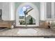 View of the kitchen sink with granite countertops and a beautiful arched window with natural light at 745 Glengate Pl, Atlanta, GA 30328