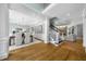 Open concept living area featuring hardwood floors, fireplace, and dining space at 745 Glengate Pl, Atlanta, GA 30328