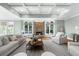 The living room features neutral colors, coffered ceiling and a cozy stone fireplace at 745 Glengate Pl, Atlanta, GA 30328