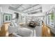 Bright, airy living room with coffered ceilings, hardwood floors, and large windows at 745 Glengate Pl, Atlanta, GA 30328