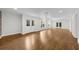 Open-concept living room with hardwood floors, recessed lighting, and multiple access points at 745 Glengate Pl, Atlanta, GA 30328