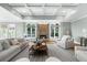 The living room features neutral colors, coffered ceiling and a cozy stone fireplace at 745 Glengate Pl, Atlanta, GA 30328