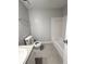 Clean bathroom featuring tile floors, a toilet, and a shower-tub combination at 1081 Forest Path, Stone Mountain, GA 30088