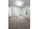 Bright bedroom with a window and carpet flooring, providing a comfortable and inviting space at 1081 Forest Path, Stone Mountain, GA 30088