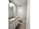 Well-appointed half bathroom with granite countertop and tile flooring at 1081 Forest Path, Stone Mountain, GA 30088