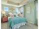 Cozy bedroom with light-green walls, a comfortable bed, and decorative butterfly art at 6139 Wayburn St, Tucker, GA 30084