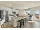 Spacious kitchen with stainless steel appliances, center island, and direct access to outdoor deck at 6139 Wayburn St, Tucker, GA 30084